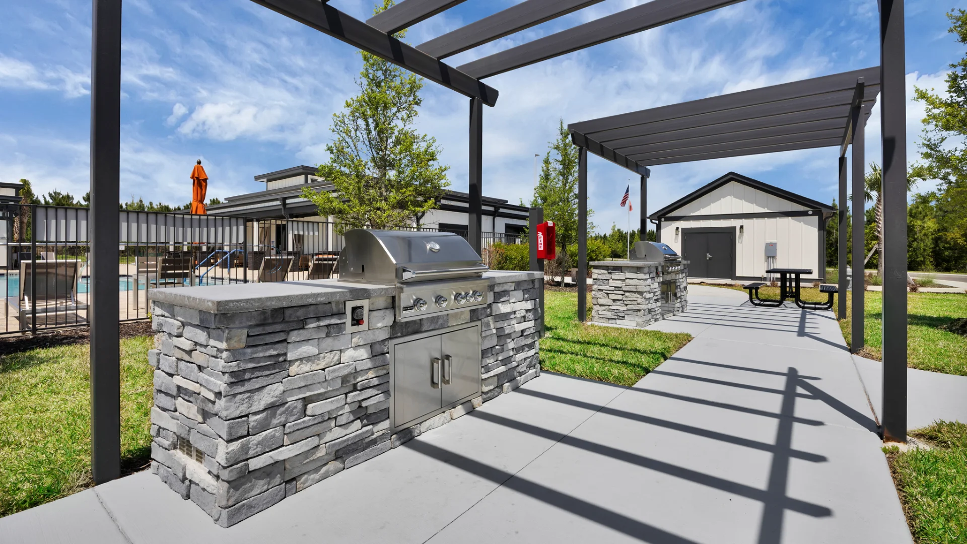 Outdoor kitchen and BBQ grills at a Pointe Grand community
