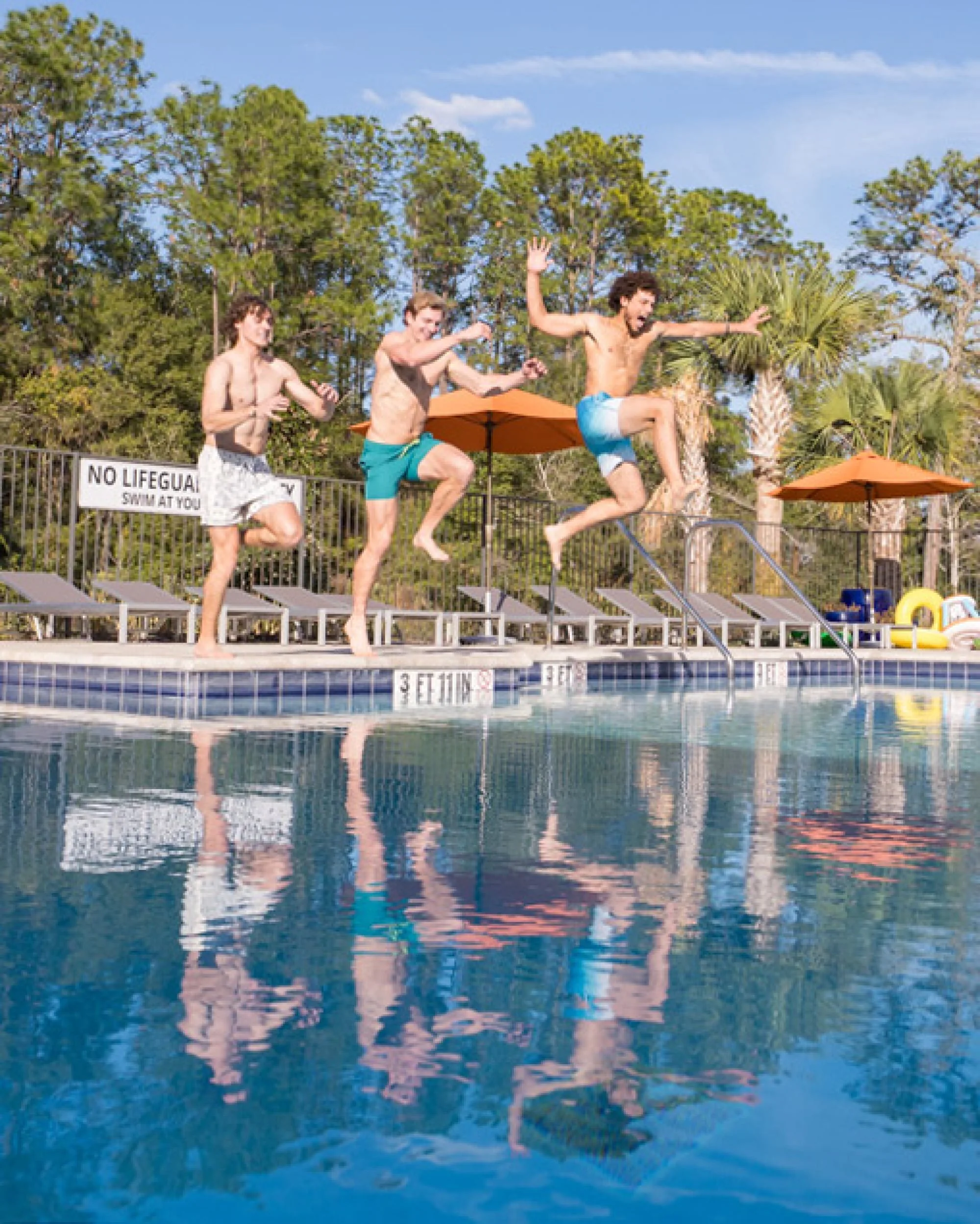 Residents at the pool at a Pointe Grand community